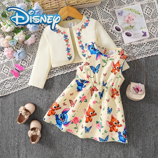 Children's outfit with floral and animal print dress, jacket, and shoes on a textured surface with Disney branding.