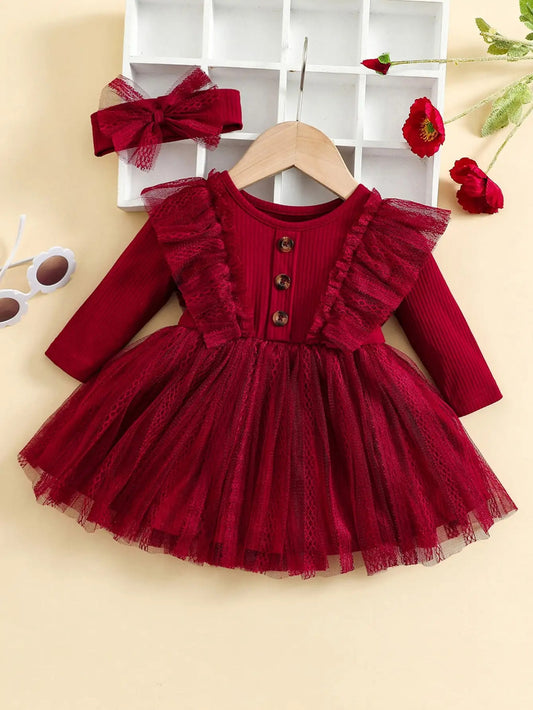 Red dress with ruffles and a matching headband on a beige background