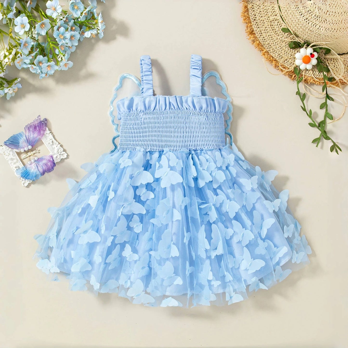 Light blue dress with butterfly pattern on a beige background